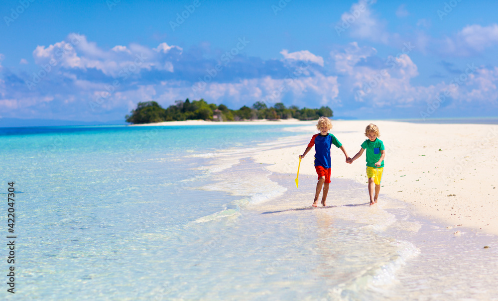 Kids playing on beach. Children play at sea. Kids playing on beach. Children play at sea.