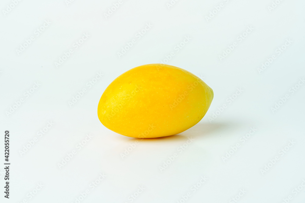 Yellow Marian plum on white background. Isolated of Marian plum fruit. Yellow Marian plum on white background. Isolated of Marian plum fruit.