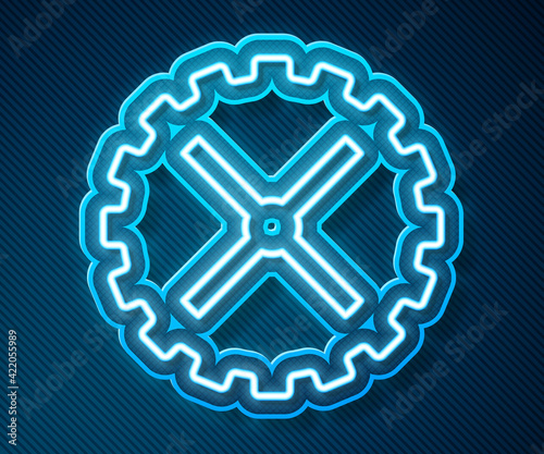 Glowing neon line Bicycle sprocket crank icon isolated on blue background. Vector