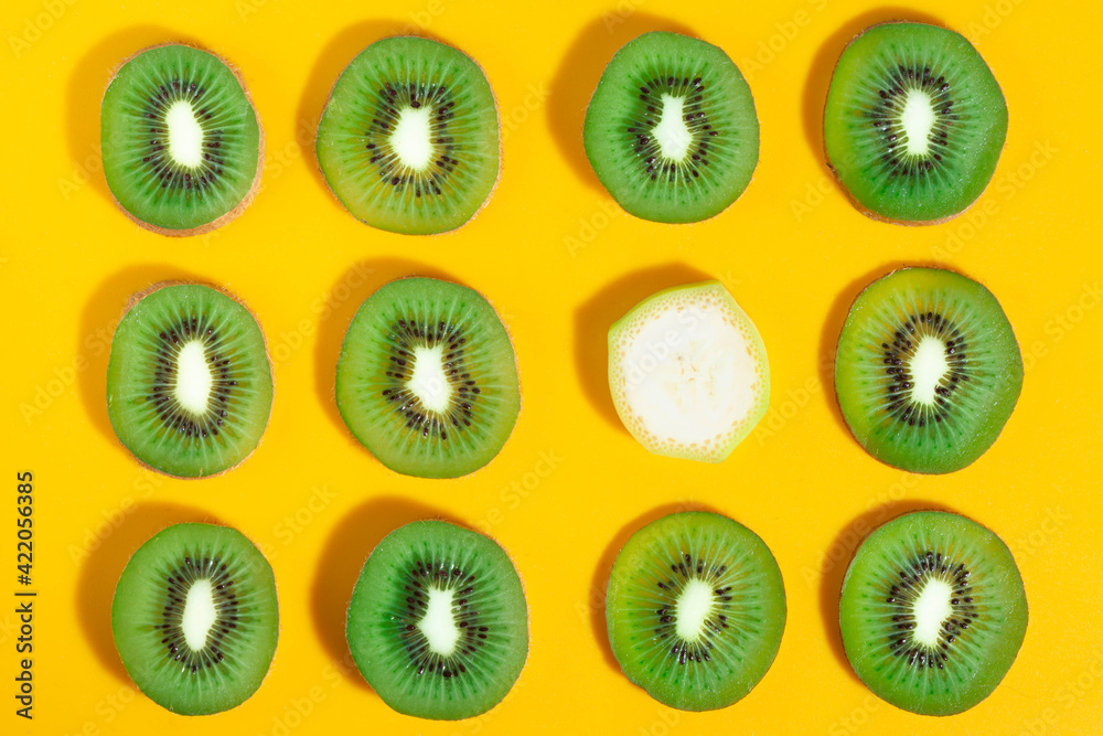 Fototapeta premium kiwi fruit on yellow background