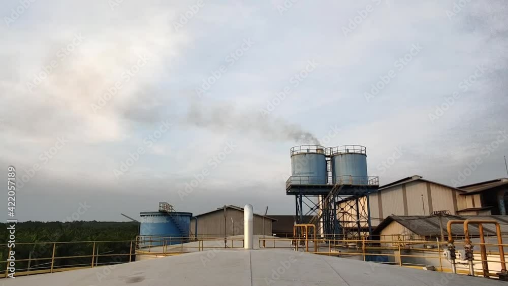 Waste smoke, exhaust  From industrial plants  A group of black smoke from the exhaust chimney inside the factory. Environmental pollution.  Air pollution. Global warming 