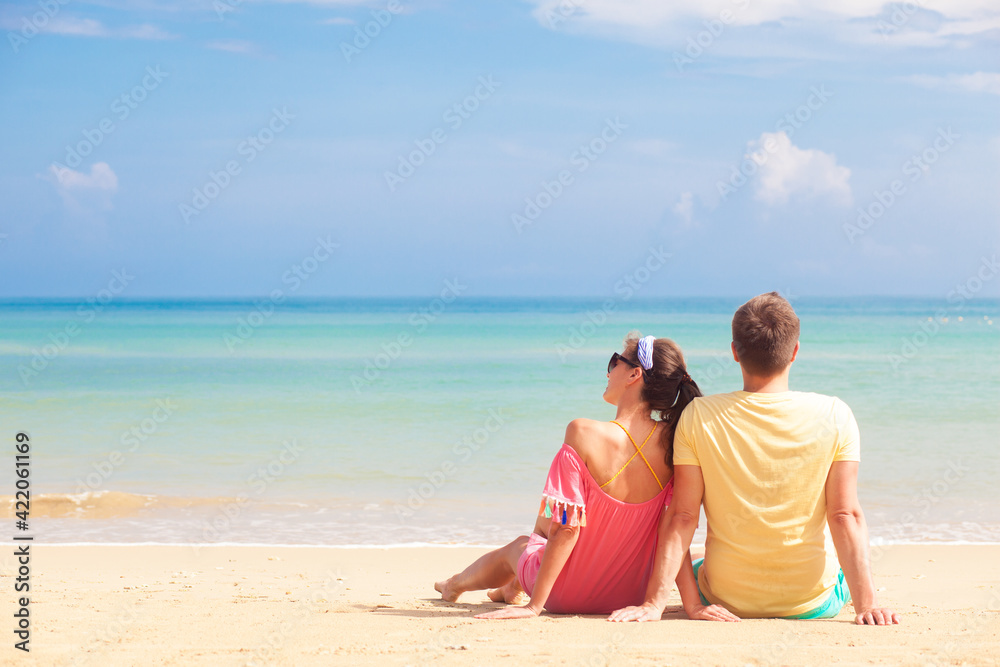 Fototapeta premium happy young couple lying and having fun on a tropical beach