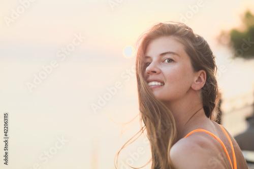 Happy vacation woman on beach summer holiday in cheerful bliss enjoying the sunshine. Beautiful girl