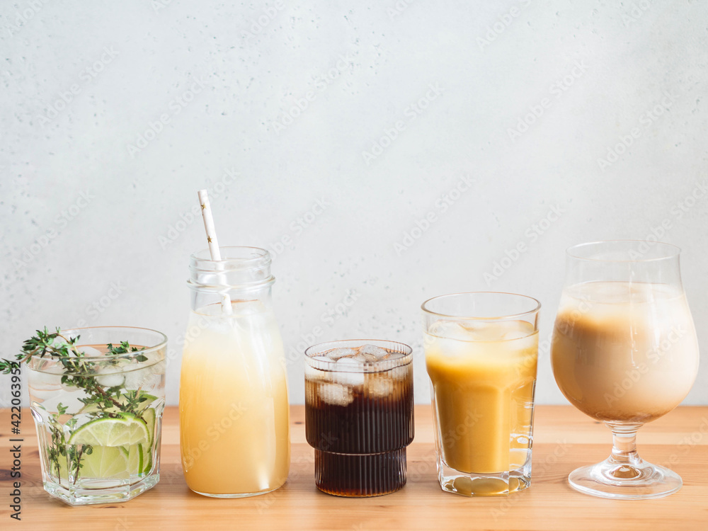 Various refreshing non-alcoholic drinks in glasses with ice. Various refreshing non-alcoholic drinks in glasses with ice.
