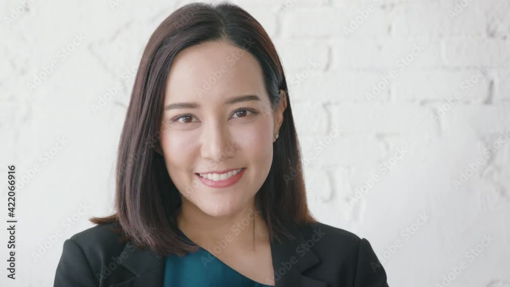 Portrait of beautiful asian businesswoman is smiling in coffee shop Portrait of beautiful asian businesswoman is smiling in coffee shop