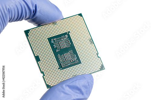 Hand holding a CPU in isolated white blackground