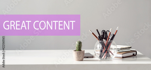 GREAT CONTENT – text on the background of the office table. Business concept.