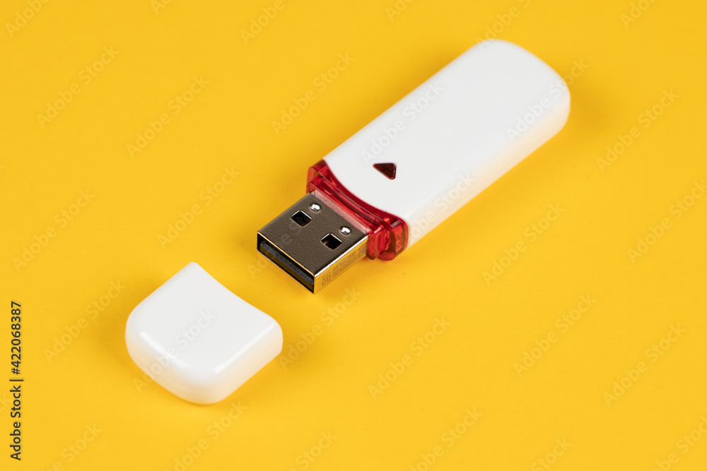 USB flash drive on yellow background USB flash drive on yellow background