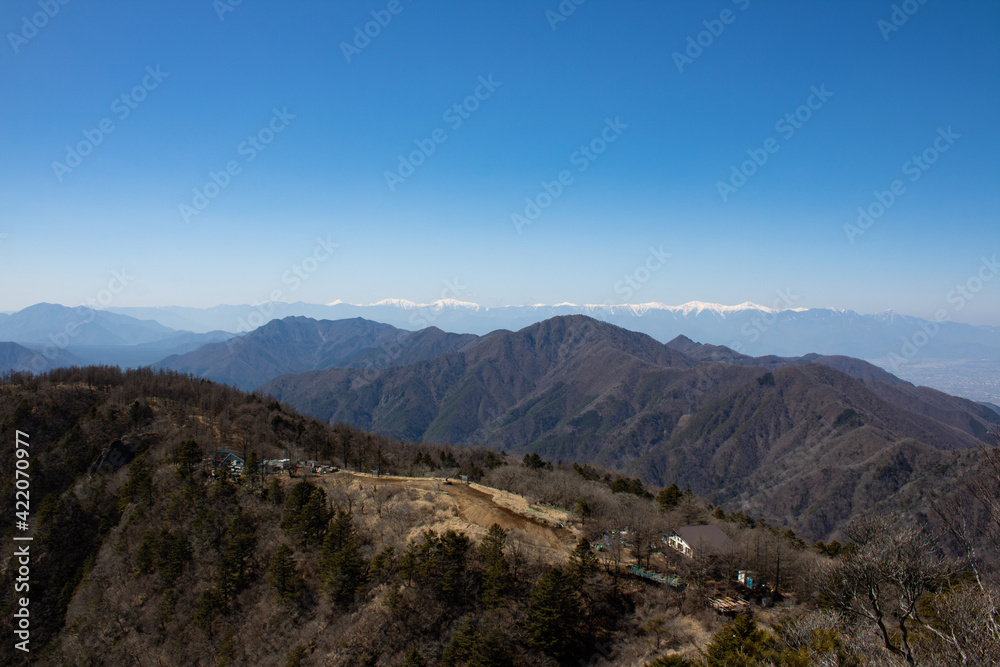Mountain range (Southern Alps) covered with snow and Mt.Mitsutoge