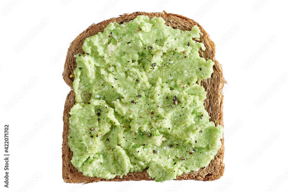 Brown cereal bread toast with salted and peppered avocado paste isolated Brown cereal bread toast with salted and peppered avocado paste isolated