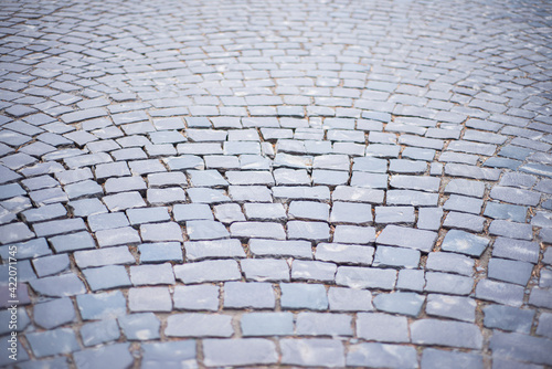 stone pavement texture, Old square stone tiles on the road and sidewalk, old style stone paving stone masonry, stone dirt road in the old town, laying slabs on the roads