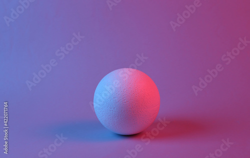 Ball in red-blue neon light. Minimalism.