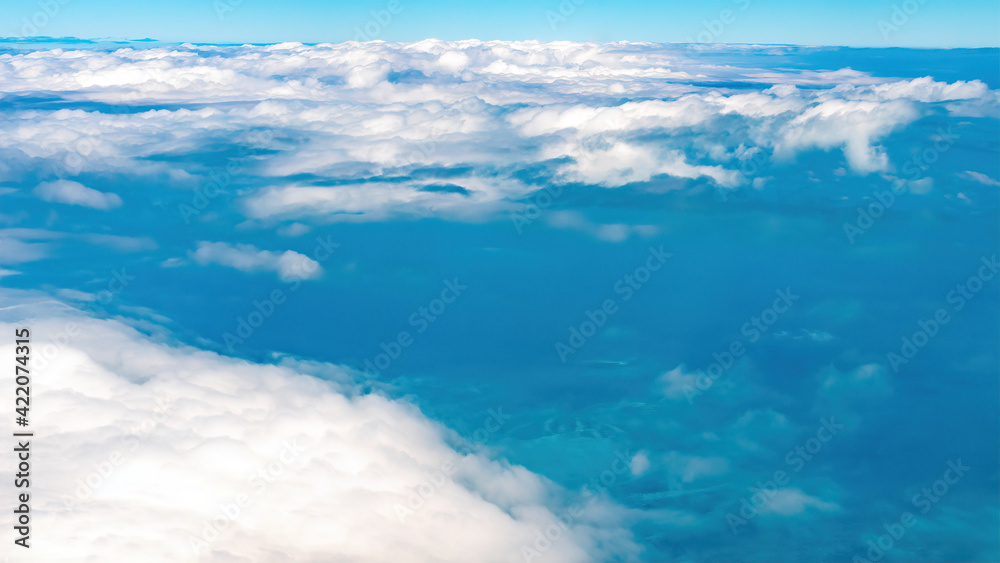 Beautiful cloud patterns are seen from a commercial airplane