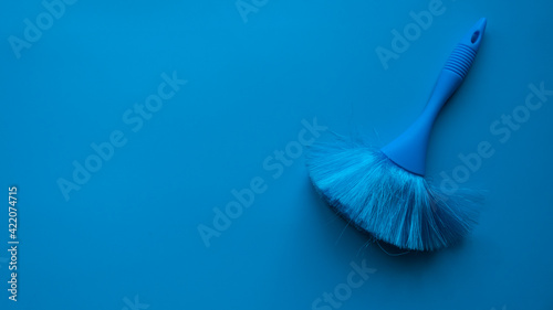 Photos Blue cleaning brush on a blue background.