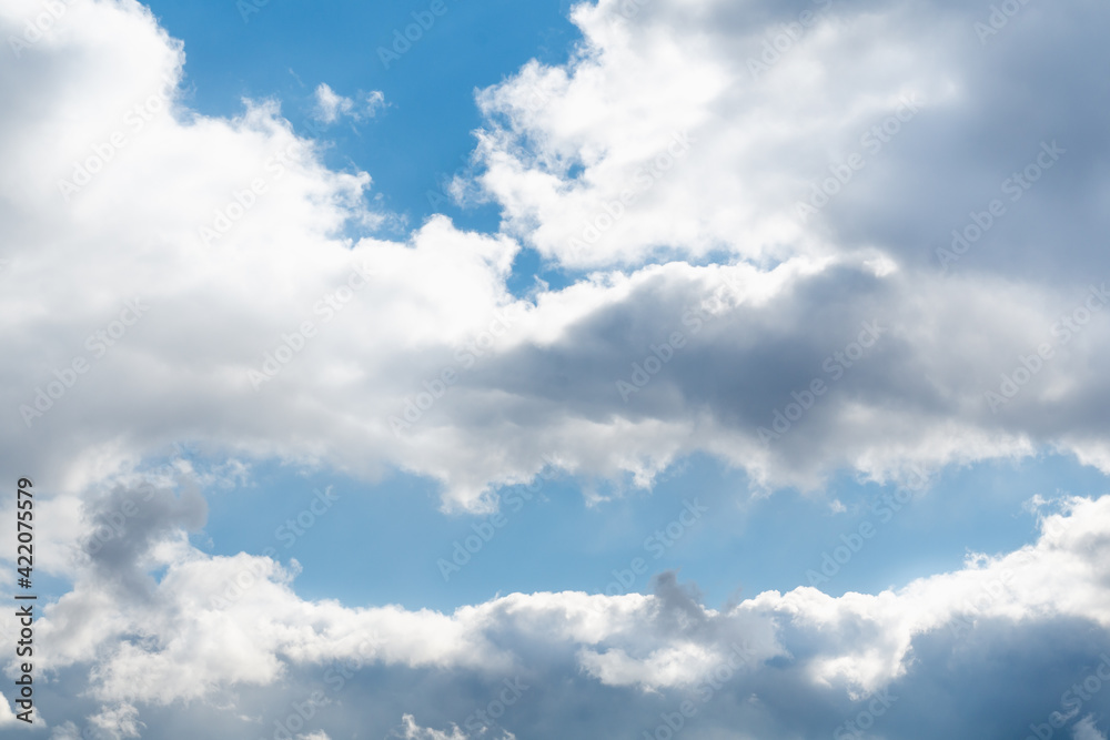 Spring blue sky with white clouds and skylights on a bright sunny day, soft focus Spring blue sky with white clouds and skylights on a bright sunny day, soft focus