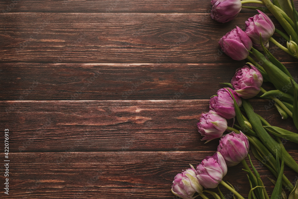 Spring flowers. Bouquet of tulips on a wooden background. Mothers Day.