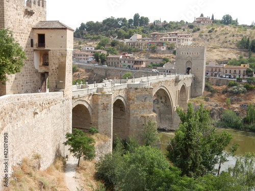 The famous Double Arch Tagus River Alcantara Bridge in Toledo, Spain, Connecting the Surrounding Countryside to the Toledo, Alcázar de Toledo, Hill once the Capitol of Spain	 photo