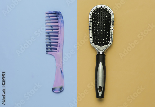 Combs on pastel background. Beauty minimalistic concept. Hair care. Top view