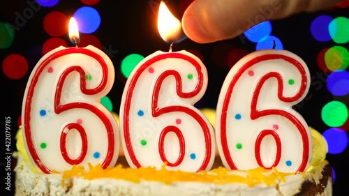 Number 666 Happy Birthday Cake With Burning Candles Topper.