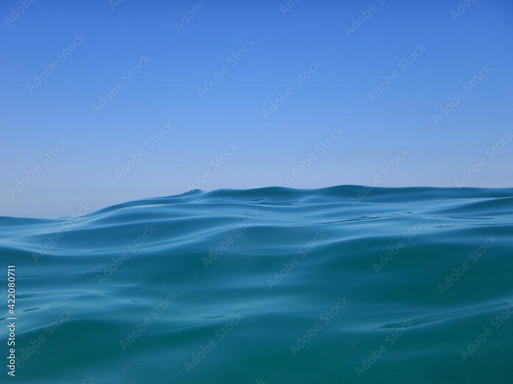 Fototapeta premium Great wave on the blue open sea with blue sky only in background