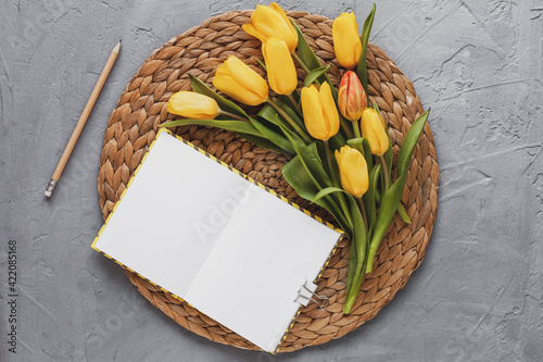 Spring mockup with yellow tulips, top view photo