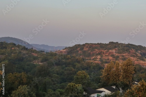 Landscape view from the top of the Panch Pandav caves, Pachmarhi, Madhya Pradesh, India. Beautiful hut at the garden of pandav cave in Pachmarhi, India with selective focus and copy space.
 photo