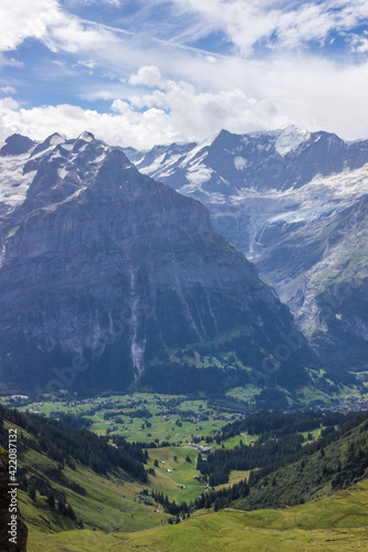 The Grindewald Valley and mountain trail in Switzerland on a sunny day © tmag