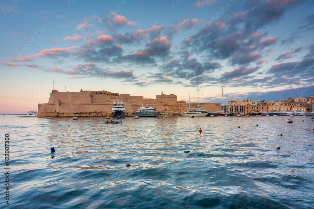 Battlement walls of the old town in Birgu at sunset, Malta