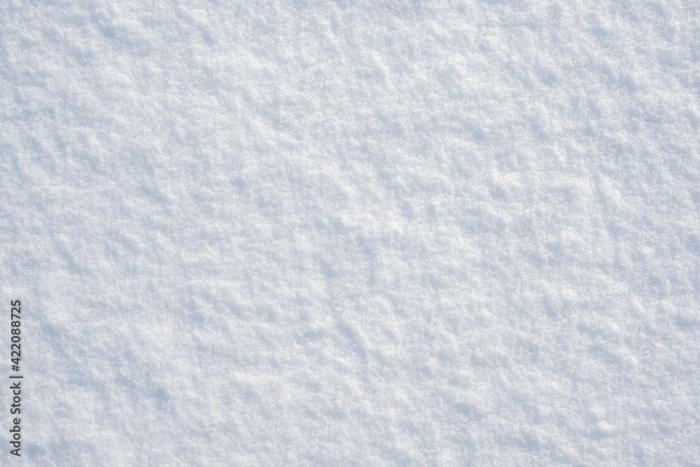 Fresh clean white snow background texture. Winter background with frozen snowflakes and snow mounds. Snow lumps. Seasonal landscape details. Cold weather.