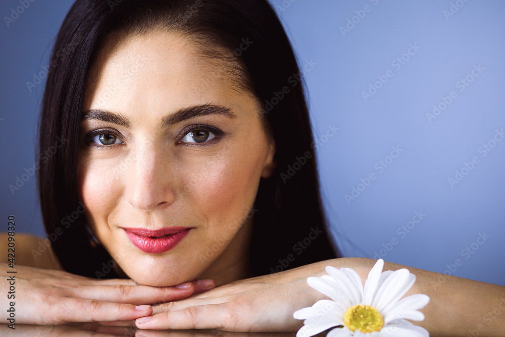 Portrait of smiling brunette woman looking at camera. Beauty concept Portrait of smiling brunette woman looking at camera. Beauty concept