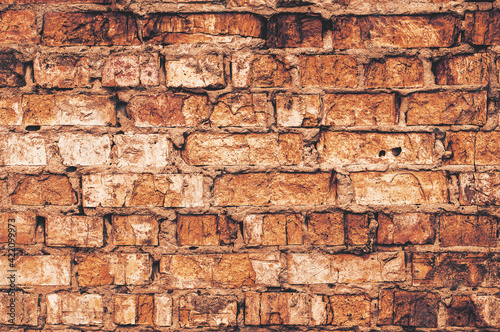 Old vintage dirty brick wall as background or texture