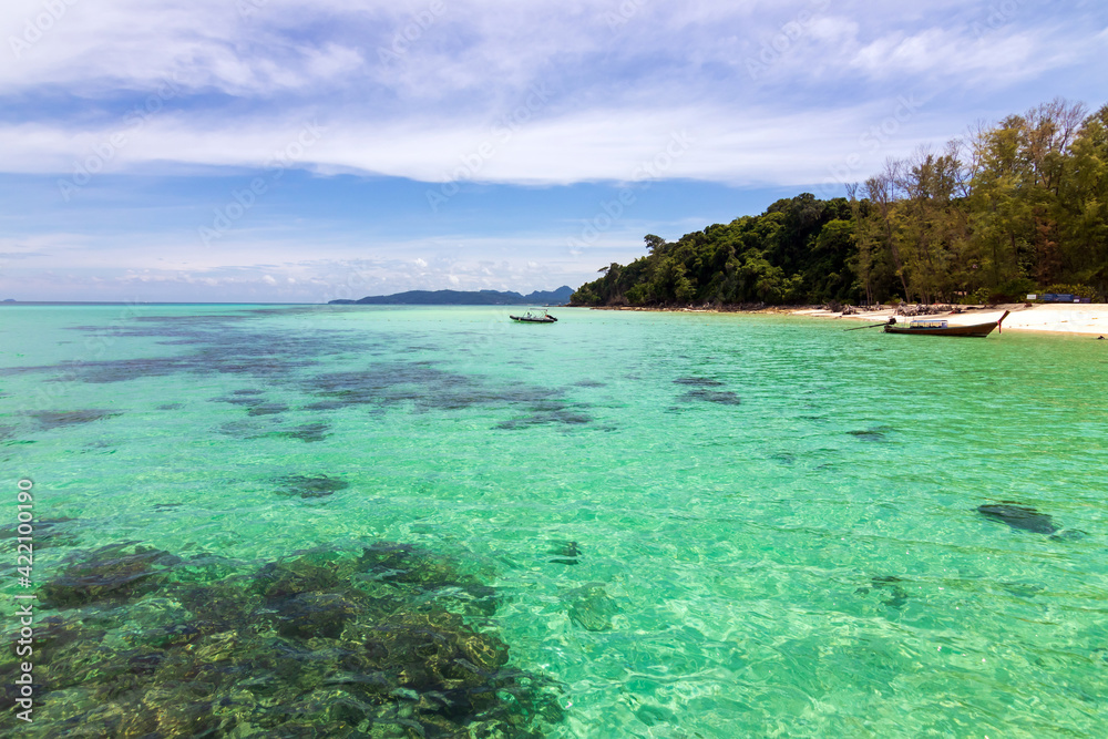 Beautiful white sand beach with blue sky and turquoise sea of Bamboo island or Koh Mai Pai. Phi Phi island national park in Krabi, Thailand. Beautiful white sand beach with blue sky and turquoise sea of Bamboo island or Koh Mai Pai. Phi Phi island national park in Krabi, Thailand.