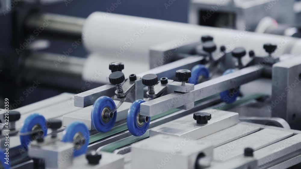 Automatic robotic Conveyor line for the production of boxes. Modern factory of production cardboard box. Manufacture of cardboard boxes from paper. Enterprise for production package Automatic robotic Conveyor line for the production of boxes. Modern factory of production cardboard box. Manufacture of cardboard boxes from paper. Enterprise for production package