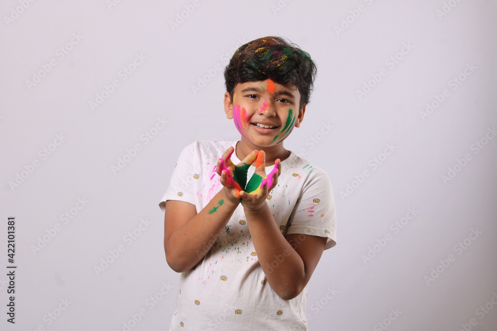 Concept for Indian festival. kid playing with colours or asian children celebrating holi - festival of colours Concept for Indian festival. kid playing with colours or asian children celebrating holi - festival of colours