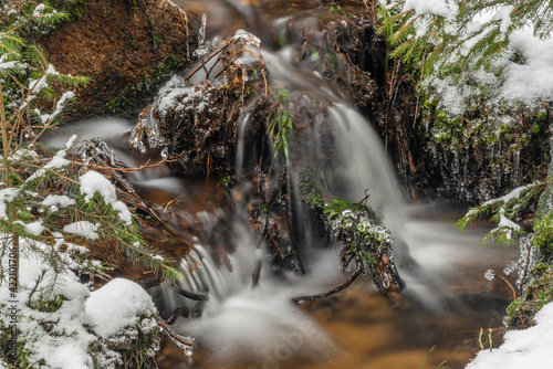 Snowy frosty small creek in Ceska Kanada area in south Moravia photo