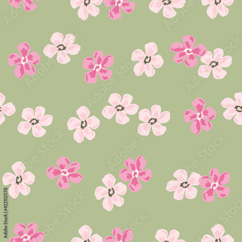 Vintage seamless pattern with random pink colored flowers bud ornament. Green pale background. Botany artwork.