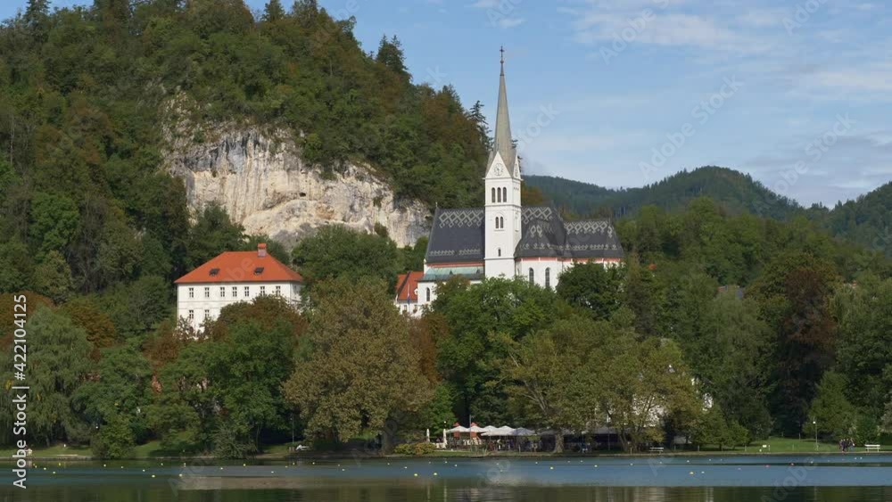 Beautiful summer landscape with Bled lake and Church of Saint Martin, Slovenia. Bled lake, the upper Carniolan region of northwestern Slovenia Beautiful summer landscape with Bled lake and Church of Saint Martin, Slovenia. Bled lake, the upper Carniolan region of northwestern Slovenia