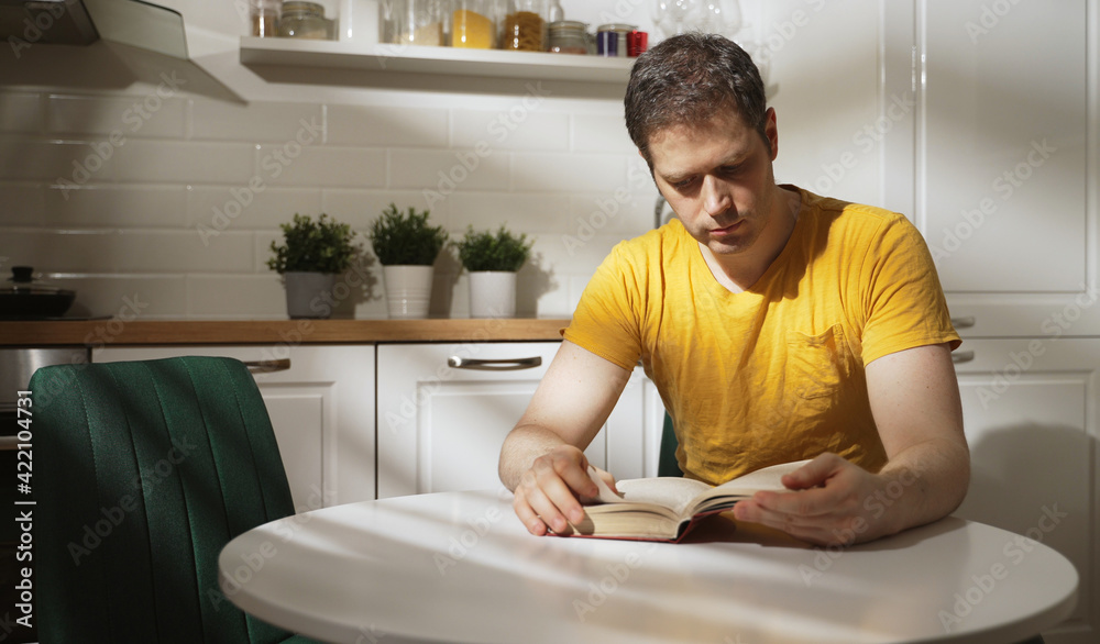 Man reading book early in the morning. Man reading book early in the morning.