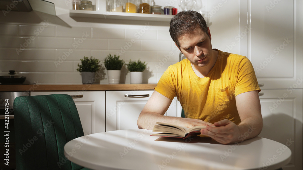 Man reading book early in the morning. Man reading book early in the morning.