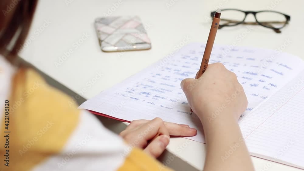 Young girl doing homework at home Young girl doing homework at home