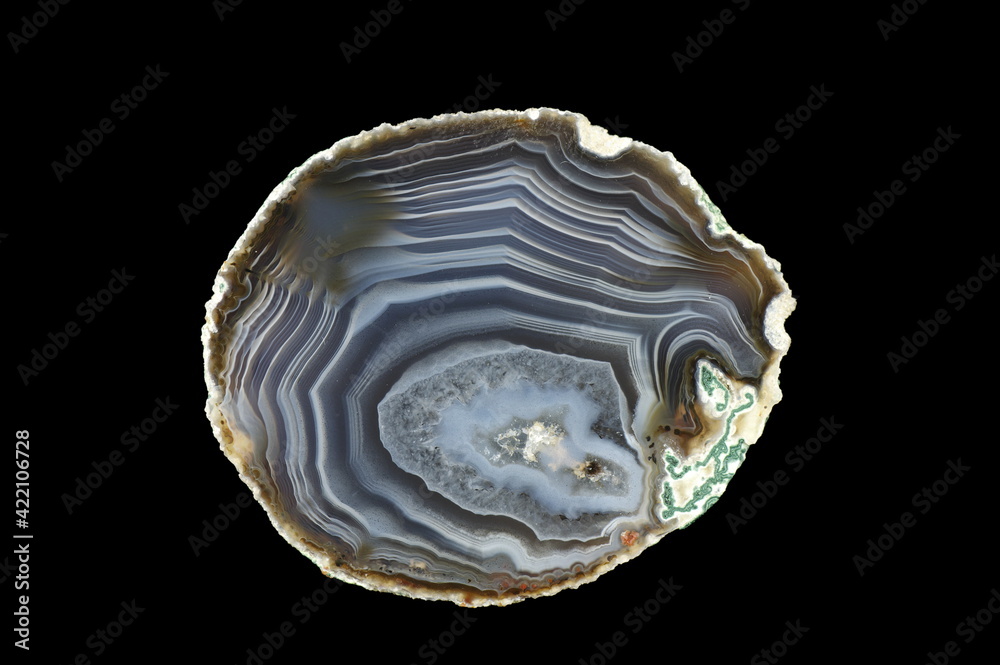 A cross section of the agate stone. Silica bands colored with metal oxides are visible. Origin: Rudno near Krakow, Poland.
