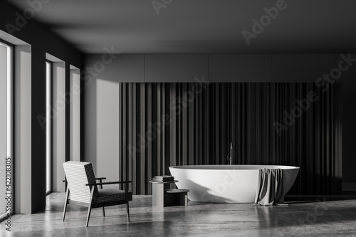 Dark bathroom interior with bathtub  slatted partition and panoramic window