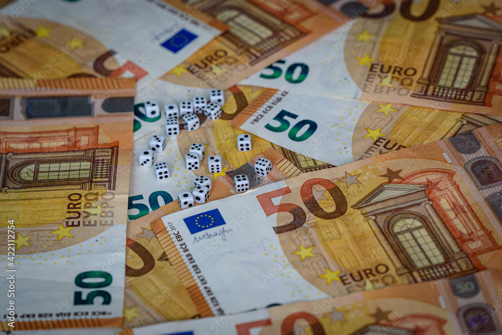 several white dice and euro money several white dice and euro money