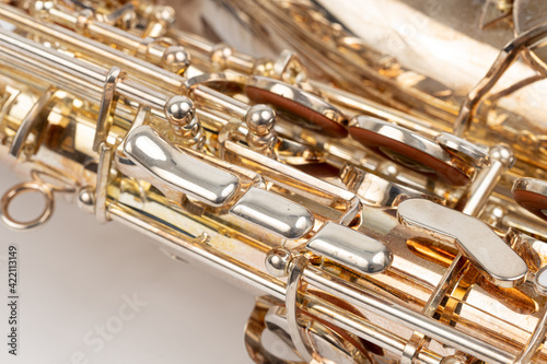 Brand new metal Saxophone isolated above white background