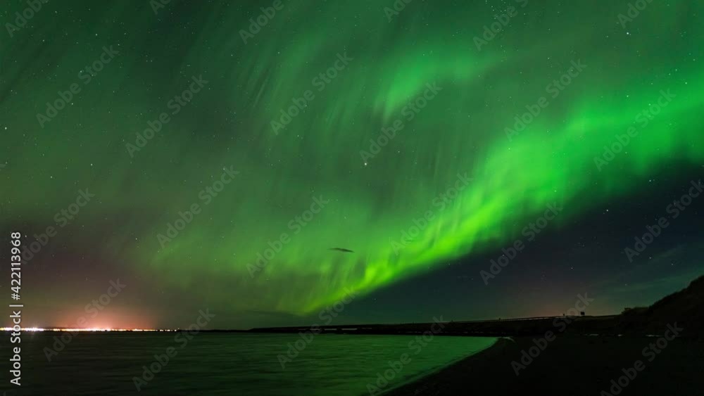 A ribbon of Northern lights across the sky in Iceland - time-lapse video