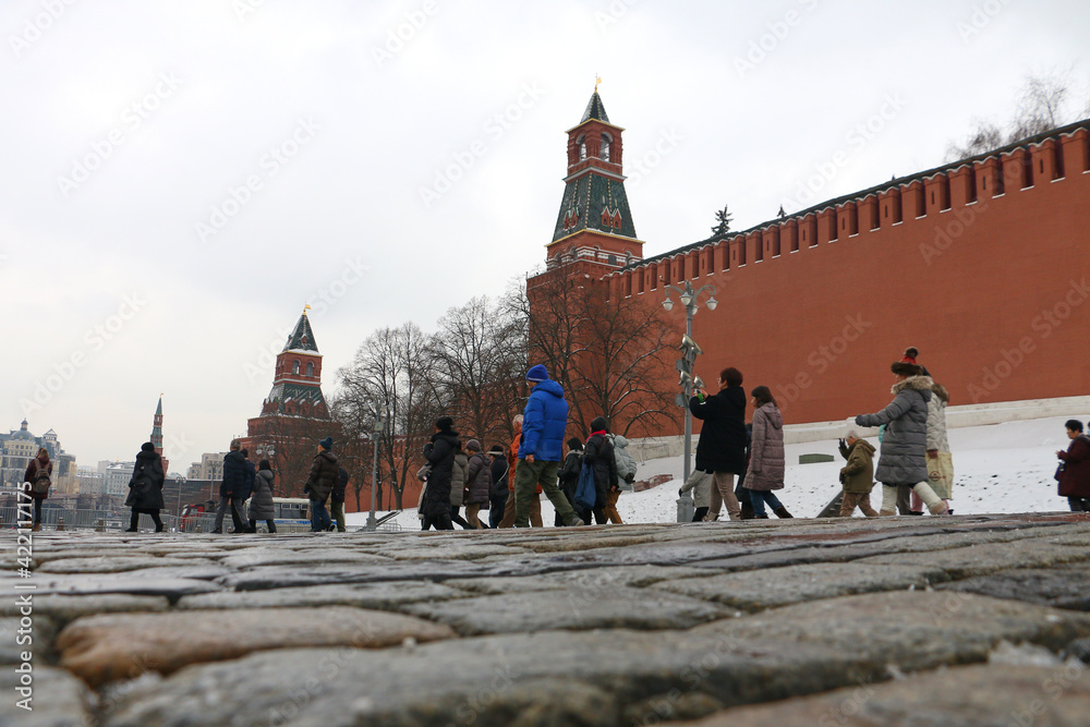 Moscow, Russia - May 10, 2015: Tourists walk on Red Square in Moscow. Red Square, the main square of Moscow, located in the center of the radial-circular layout of the city