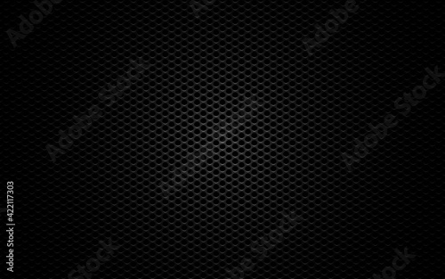 Metal mesh. Black perforated texture. Carbon backdrop with gradient light. Dark sheet metal. Steel plate with cells. Futuristic material. Vector illustration