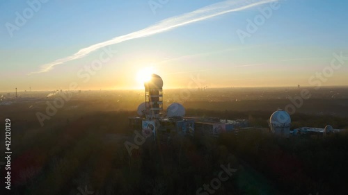 Wallpaper Mural flying over abandoned surveillance station in berlin during bright sunrise Torontodigital.ca