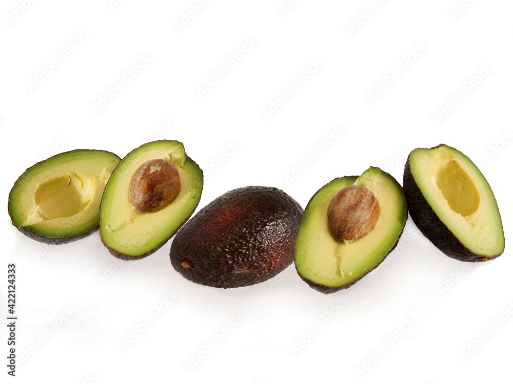 halves of cut avocado fruits close up