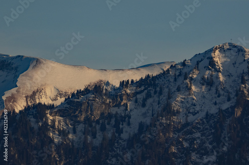 Snow-covered mountain ridge in the winter evening light